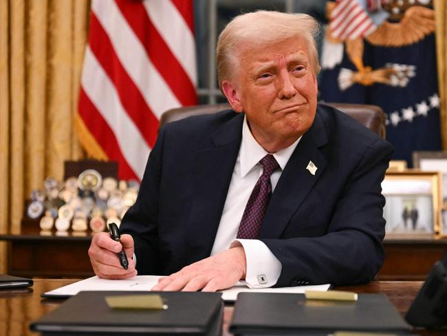 US President Donald Trump signs executive orders in the Oval Office of the White House in Washington, DC, on January 20, 2025. Picture: NewsWire / Jim WATSON / POOL / AFP