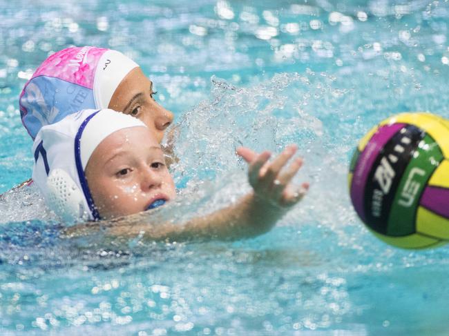 FOR ONLINE GALLERYLucy Taylor from Brisbane Girls Grammar School U/12s in action against Mermaids at the Australian Youth Water Polo Championships at Brisbane Aquatic Centre. Photo Lachie Millard
