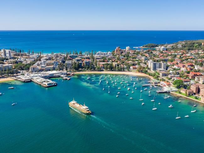 The Manly Ferry approaches the wharf, Sydney Harbour.
