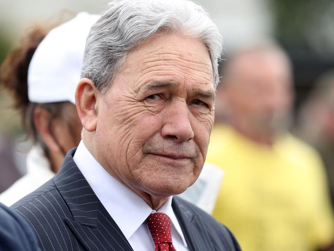 AUCKLAND, NEW ZEALAND - OCTOBER 01: New Zealand First leader Winston Peters (R) in the crowd as farmer lobby group Groundswell NZ gathers in Auckland to raise awareness and urge people to vote in the general election on October 14 at Ellerslie Racecourse on October 01, 2023 in Auckland, New Zealand. The convoy of tractors and farm vehicles started in Invercargill 10 days ago and was joined by farmers along the journey to Auckland.  (Photo by Fiona Goodall/Getty Images)