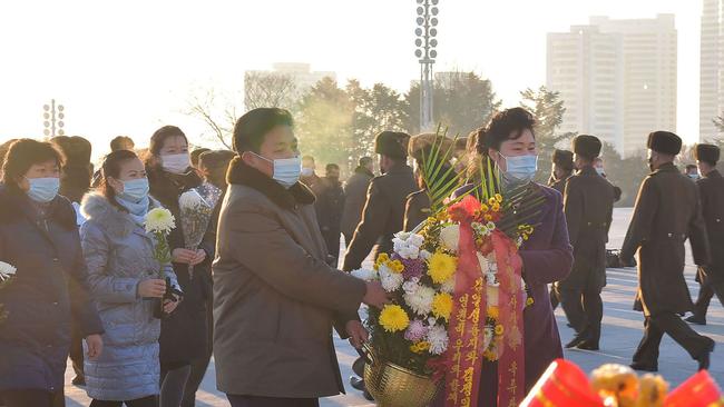 North Koreans pay their respects at the grand monument in Pyongyang on the ninth anniversary of former leader Kim Jong-il's death. Picture: Korean Central News Agency via AFP