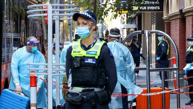 Returning Australian travellers from overseas arrive at the InterContinental Hote in Melbourne for their COVID-19 quarantine period. Picture: Ian Currie