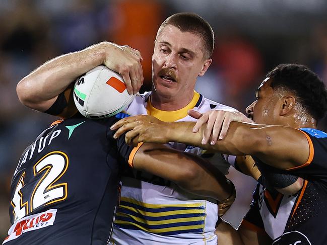 SYDNEY, AUSTRALIA – SEPTEMBER 06: Shaun Lane of the Eels is tackled during the round 27 NRL match between Wests Tigers and Parramatta Eels at Campbelltown Stadium, on September 06, 2024, in Sydney, Australia. (Photo by Jeremy Ng/Getty Images)