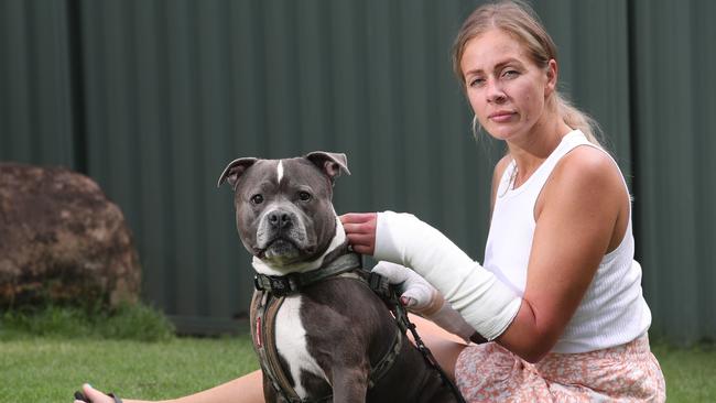 Sarah Thompson-Keevers and her dog Hank the Staffordshire Terrier were savagely attacked by a dog in Biggera Waters last week. Picture Glenn Hampson