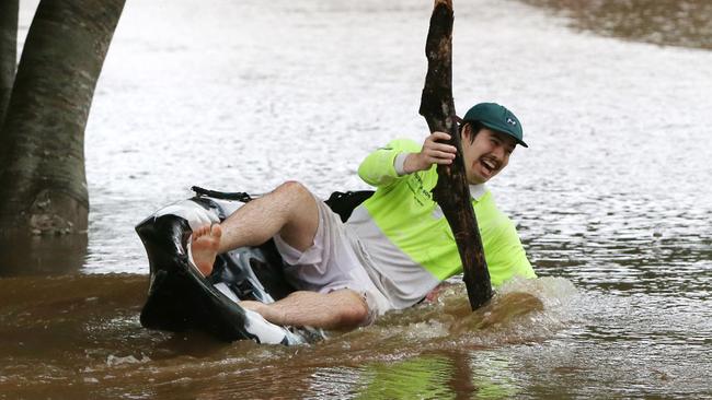 Liam Crean enjoys the flooded park at Mudgeeraba. Picture: NIGEL HALLETT