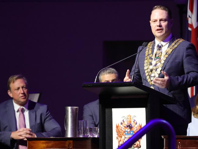 Steven Miles watches Brisbane Lord Mayor Adrian Schrinner at the Brisbane City Hall citizenship ceremony on Sunday. Picture: Steve Pohlner