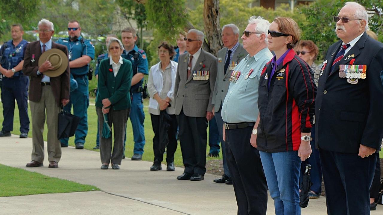 LEST WE FORGET: Commemorators gathered in the rain for Gatton's Remembrance Day services on November 11 2017. Gatton RSL sub-branch treasurer Ken Slater, Kristy Dobson and Steve Hartigan pay their respects.