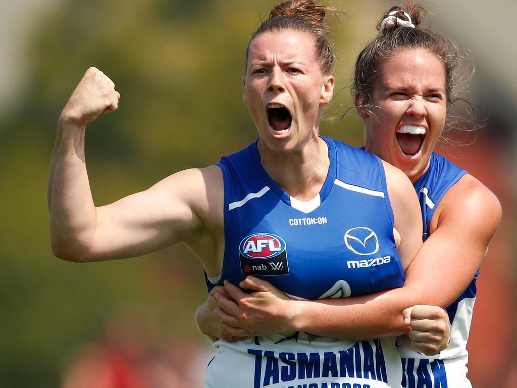 HOBART, AUSTRALIA - FEBRUARY 03: Brittany Gibson of the Kangaroos (left) celebrates a goal with Emma Kearney of the Kangaroos during the 2019 NAB AFLW Round 01 match between the North Melbourne Tasmanian Kangaroos and the Carlton Blues at North Hobart Oval on February 03, 2019 in Hobart, Australia. (Photo by Adam Trafford/AFL Media/Getty Images)