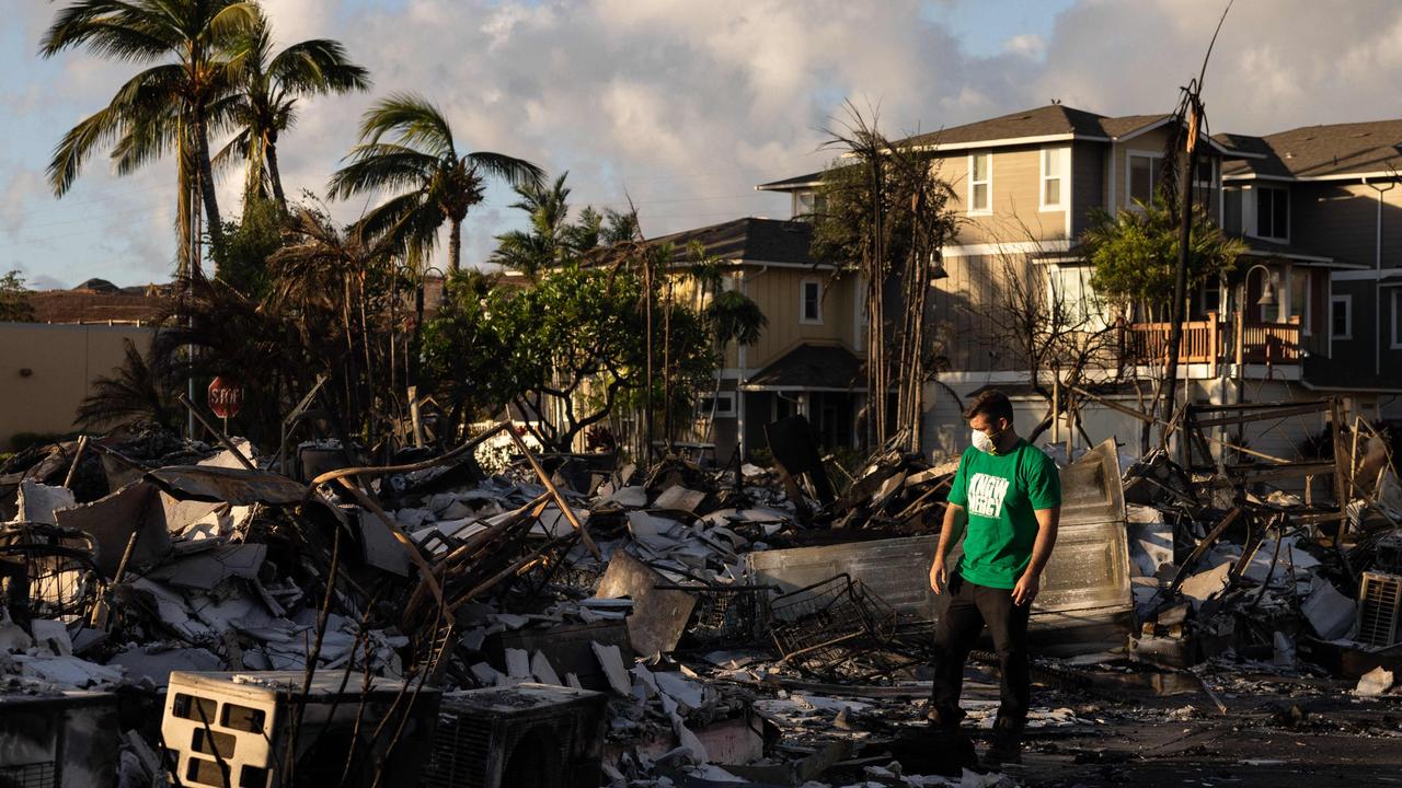 A Mercy Worldwide volunteer makes damage assessment of a charred apartment complex in Lahaina. Picture: Yuki Iwamura/AFP