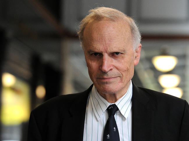 **FILE** A file image reissued Tuesday, June 23, 2020 of  former High Court judge Dyson Heydon leaving the Royal Commission into Trade Union Governance and Corruption in Sydney, Friday, Nov. 6, 2015. An independent inquiry has found former High Court judge Dyson Heydon sexually harassed six female judges' associates, which he categorically denies. (AAP Image/Joel Carrett) NO ARCHIVING