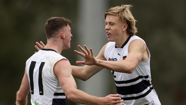 Nate Caddy (right) slotted three goals in his return. Picture: Martin Keep/AFL Photos via Getty Images