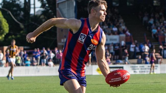 Ben Jolley getting a handball away for the Borough. Pic: Port Melbourne FC