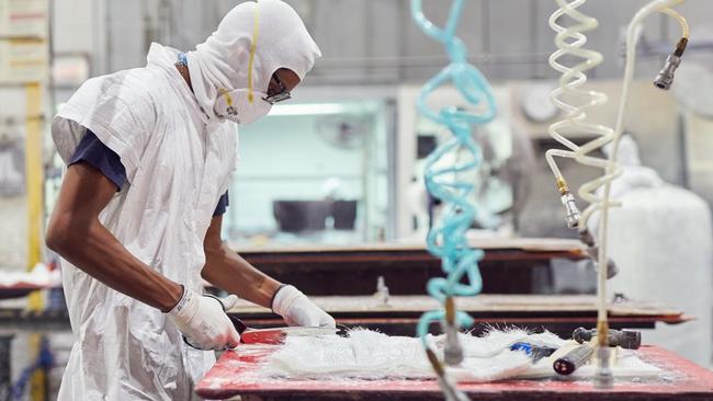 JL Audio employee Victor Rosales applies fibreglass to a speaker mould. Picture: Wall Street Journal