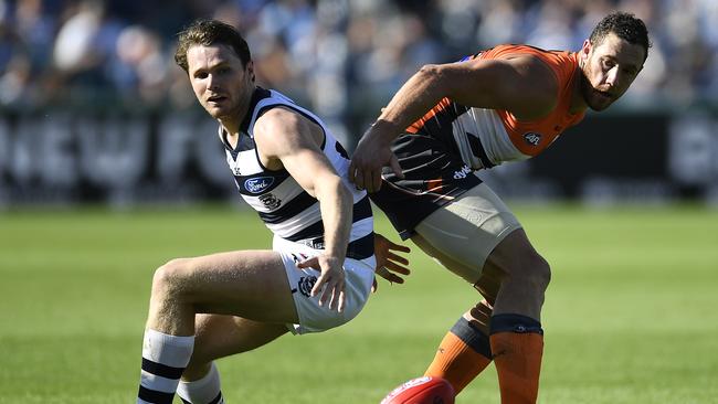 Patrick Dangerfield contests against Giant Shane Mumford. Picture: Getty