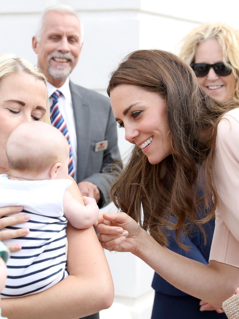 Catherine, Duchess of Cambridge greets a young baby as she visits Nansledan, a 218-hectare site that will provide future business and housing for the local area on September 1, 2016 in Newquay, United Kingdom. Picture: Getty