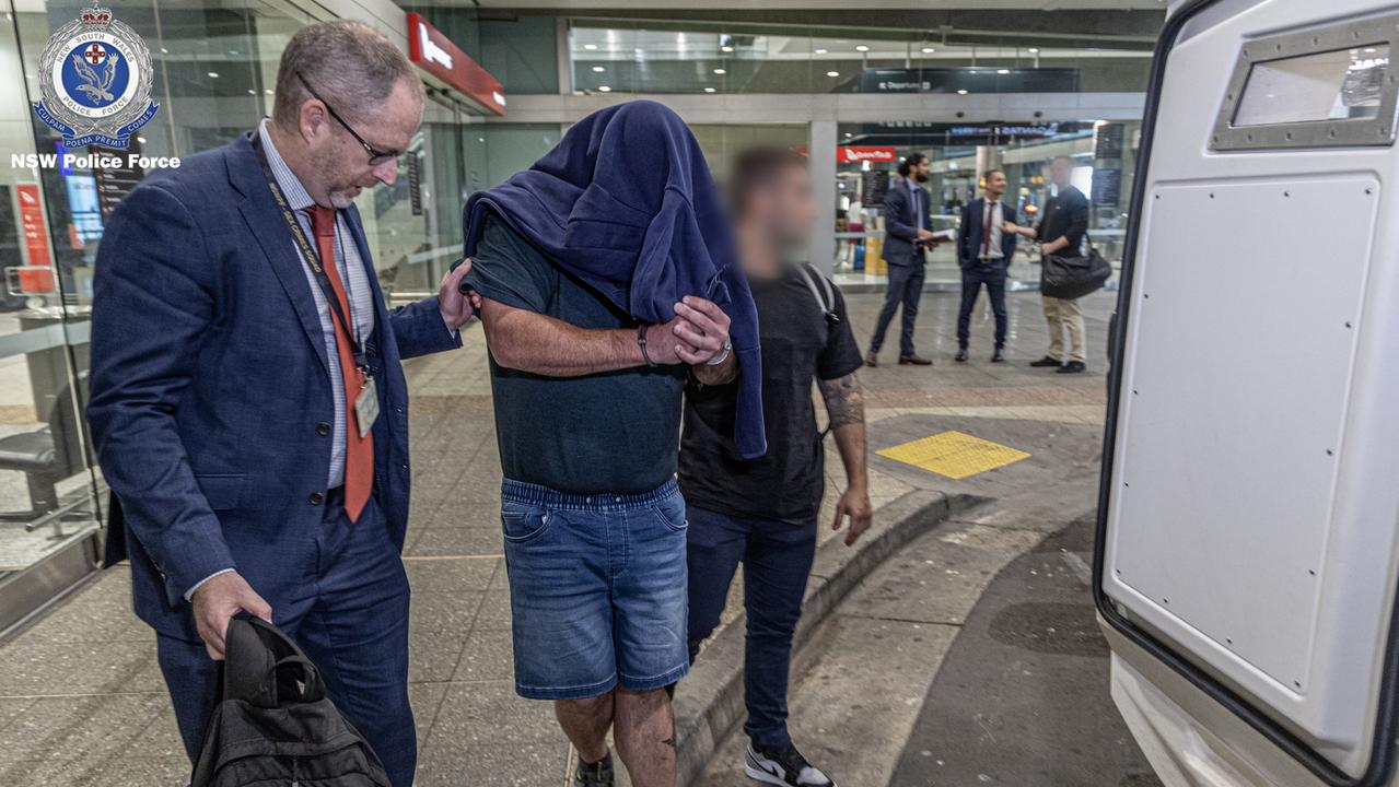 The man was escorted by detectives. Picture: NSW Police