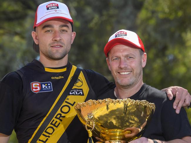 Tuesday 26th September SANFL: Glenelg Football Club West End Chimney celebrations at Brickworks. Glenelg team/players with colours unveiled on the historic Hoffmann Kiln. Glenelg player Brett Turner and coach Darren Reeves with 2023 premiership cup.Pic Roy VanDerVegt