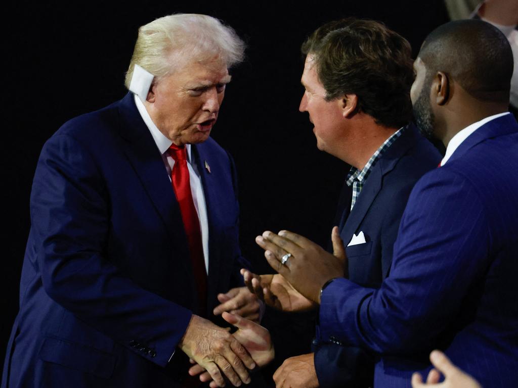 Donald Trump seen with his ear bandaged. Picture: Chip Somodevilla/Getty Images/AFP