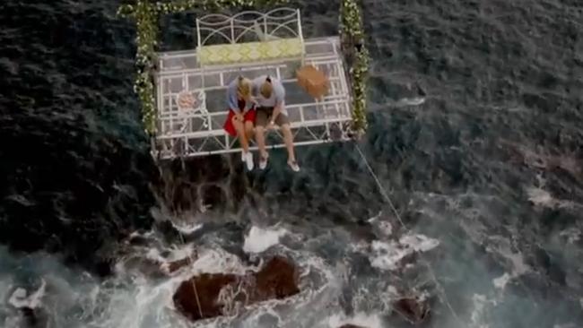 OK guys, I’m all for going to great heights to prove you’re into someone... but this is just a little too risky. Good thing Richie’s a rope technician. (Pic: Network Ten)