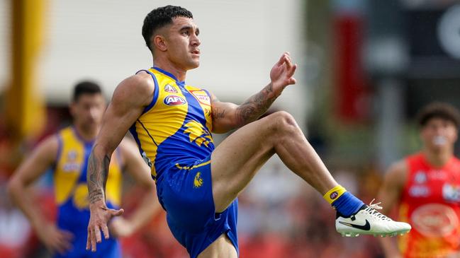 GOLD COAST, AUSTRALIA - APRIL 28: Tyler Brockman of the Eagles kicks the ball during the 2024 AFL Round 07 match between the Gold Coast SUNS and the West Coast Eagles at People First Stadium on April 28, 2024 in Gold Coast, Australia. (Photo by Russell Freeman/AFL Photos via Getty Images)