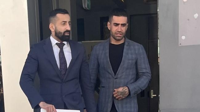 Abufaz (Also known as Abolfazi) Hosseini, right, leaving Wyong Local Court with his lawyer (left), after being convicted of stalking his girlfriend by putting an AirTag in the boot of her car. Picture: NewsLocal.