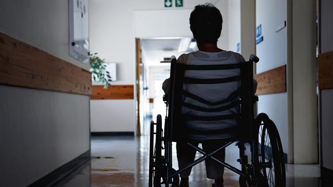 BAD AGED CARE:   Rearview shot of a senior woman sitting in a wheelchair