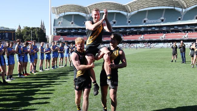 Andrew Bradley is chaired off following his 200th game for Glenelg. Picture: David Mariuz