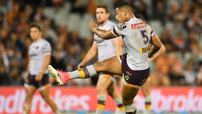 Jamayne Isaako of the Broncos kicks the winning goal with a penalty in extra time against the Tigers during the Round 3 NRL match between the Wests Tigers and the Brisbane Broncos at Campbelltown Stadium in Sydney, Friday, March 23, 2018. (AAP Image/Dean Lewins) NO ARCHIVING, EDITORIAL USE ONLY