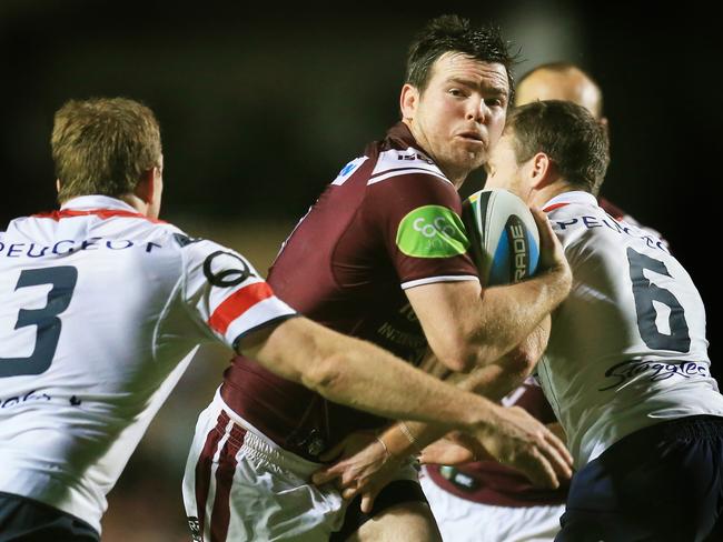 Jamie Lyon of the Sea Eagles tackled by Mitchell Aubusson and James Maloney of the Roosters during the Manly Sea Eagles v Sydney Roosters round 25 NRL game at Brookvale Oval. pic Mark Evans