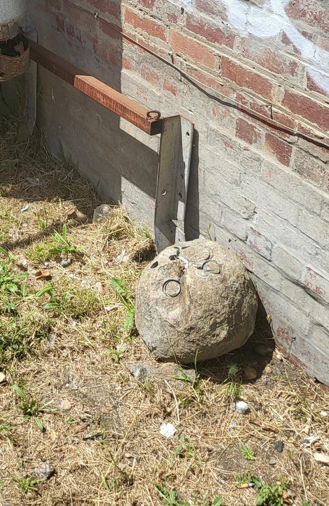 A boulder that Bay Hire claims rolled onto its premises from the proposed development site on Star St. Picture: Supplied