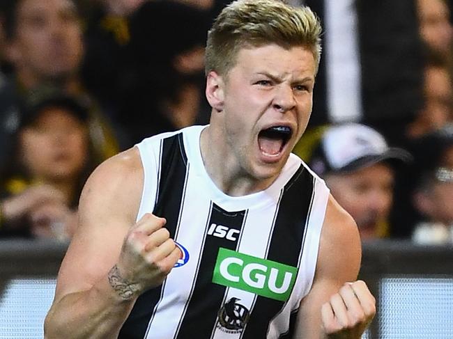 MELBOURNE, AUSTRALIA - SEPTEMBER 21:  Jordan De Goey of the Magpies celebrates kicking a goal during the AFL Preliminary Final match between the Richmond Tigers and the Collingwood Magpies on September 21, 2018 in Melbourne, Australia.  (Photo by Quinn Rooney/Getty Images)