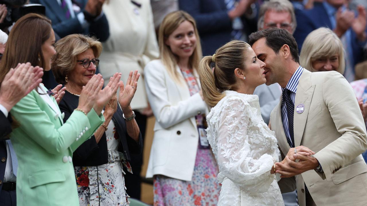 Kate pictured with Roger Federer and his wife Mirka – and her ‘right-hand woman’ Natalie Barrows (centre). Picture: Adrian Dennis/AFP