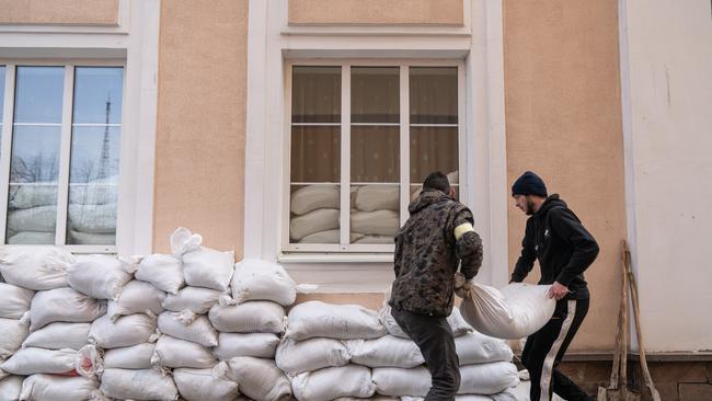 People placing sand bags next to the local cultural centre building to protect it in Ivano-Frankivsk, Ukraine. Picture: Getty Images