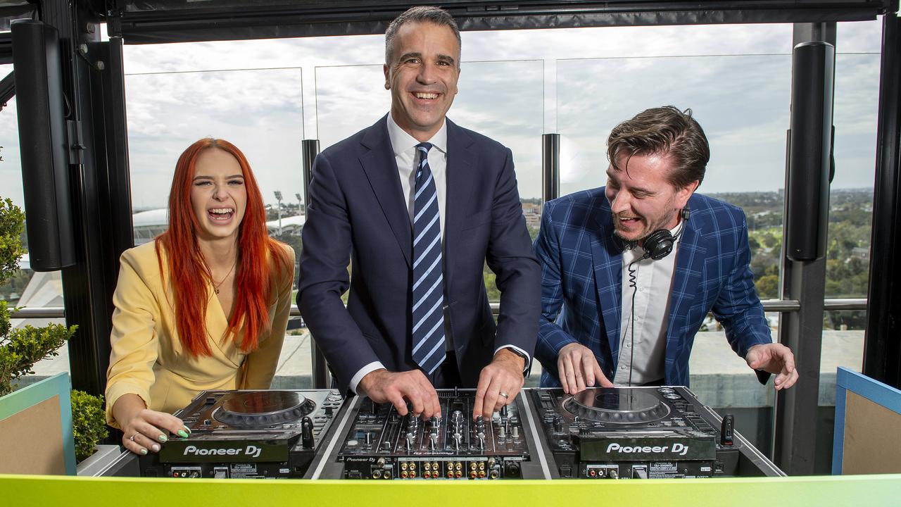 Premier Peter Malinauskas gets into the spirit of LIV Golf behind the decks with Bangaz &amp; Ash-DJ Duo Ashlee Grindle and Kai Ward at 2kw Bar &amp; Restaurant during an announcement regarding the 2025 event. Picture: Mark Brake