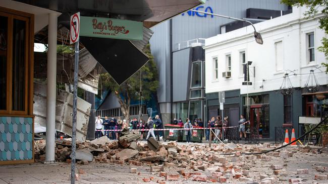 Debris on Chapel St in inner Melbourne after an earthquake rocked burger shop, Betty’s Burgers. Picture: Mark Stewart