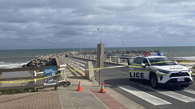 Police cordoned off the West Beach boat ramp at 6am after two cars were found submerged in the water. Picture: Todd Lewis