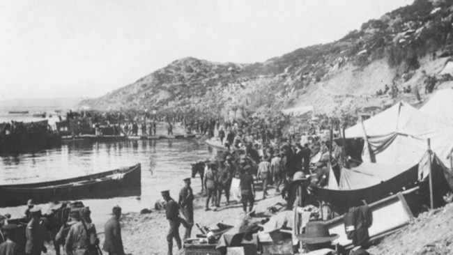 Troops, supplies and tents along the beach at Anzac Cove not long after the landing. Pic: Courtesy AWM A03092