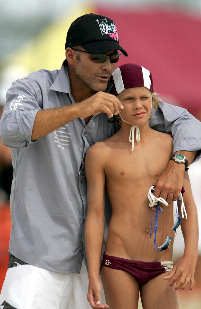 MARCH 09, 2006: QLD Nippers Titles at Kirra. Jett Kenny 11yrs getting some tips from his dad Grant Kenny. Picture: Michael/Rosssport