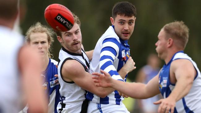 EFL: Ferntree Gully’s Harrison Mcaleese is tackled. Picture: Stuart Milligan