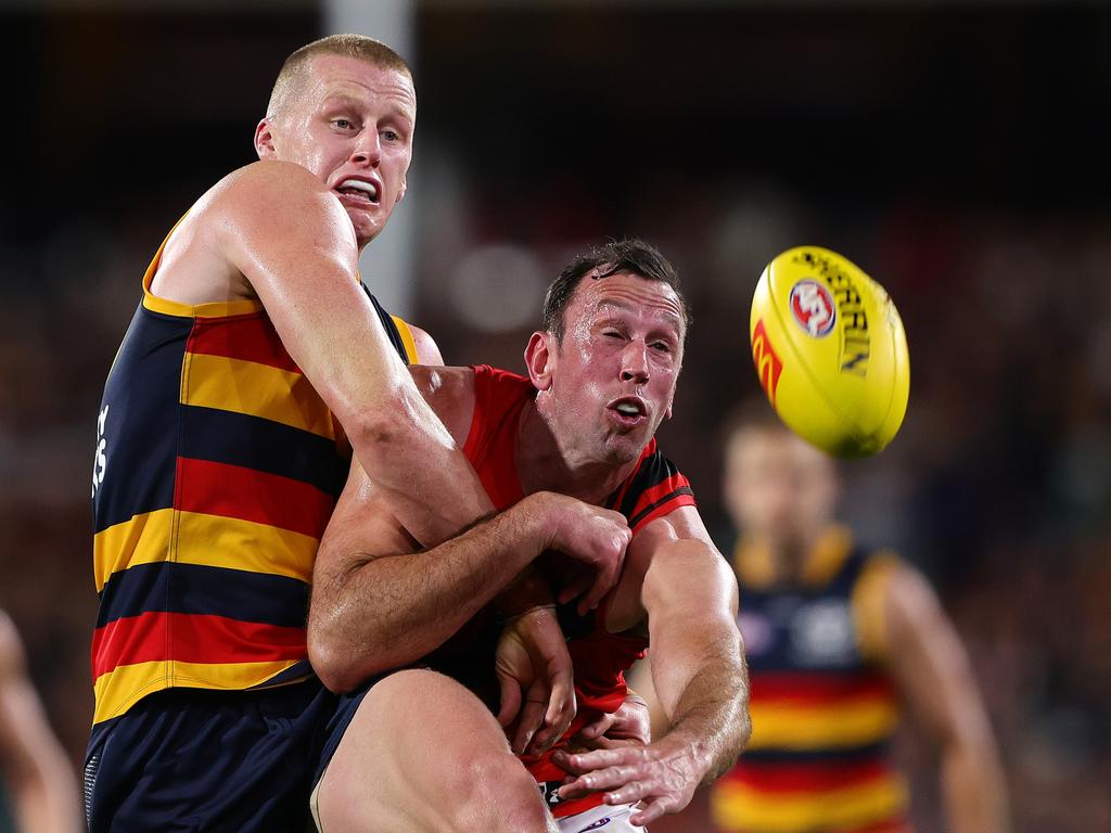 Ruckmen Reilly O’Brien and Todd Goldstein do battle. Picture: Sarah Reed/AFL Photos via Getty Images