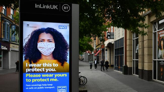 An electronic billboard in Leicester displays a government message reminding people to wear face masks. Picture; AFP.