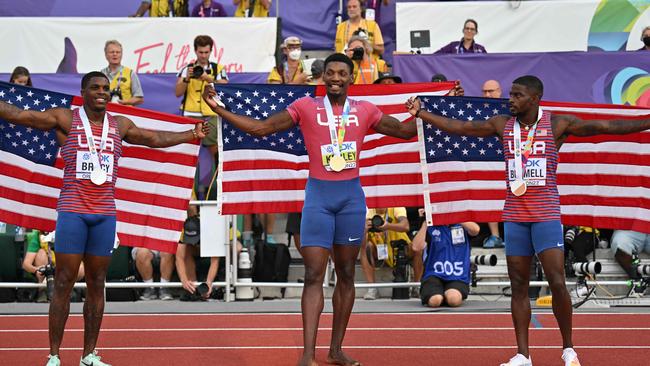 Silver medallist USA's Marvin Bracy (L), gold medallist USA's Fred Kerley (C) and USA's Trayvon Bromell (R) celebrate after the men's 100m final during the World Athletics Championships. (Photo by ANDREJ ISAKOVIC / AFP)