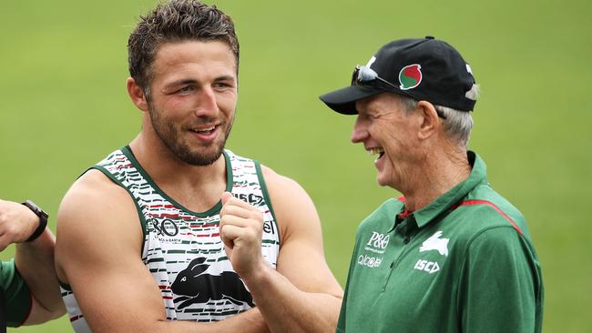 SYDNEY, AUSTRALIA - DECEMBER 04: New South Sydney Rabbitohs Coach Wayne Bennett shares a laugh with Sam Burgess after a Sydney Rabbitohs training session at Redfern Oval at Redfern Oval on December 4, 2018 in Sydney, Australia. (Photo by Mark Kolbe/Getty Images)