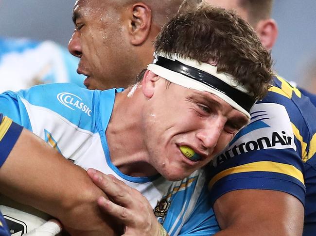 SYDNEY, AUSTRALIA - AUGUST 04:  Jarrod Wallace of the Titans is tackled by the Eels defence during the round 21 NRL match between the Parramatta Eels and the Gold Coast Titans at ANZ Stadium on August 4, 2018 in Sydney, Australia.  (Photo by Brendon Thorne/Getty Images)