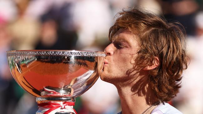 Rublev kisses the trophy. Photo by Clive Brunskill/Getty Images