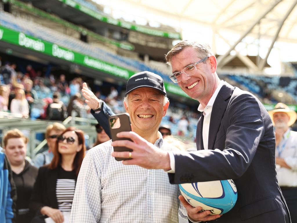 NSW Premier Dominic Perrottet takes a selfie with a member of the public during the community open day at Allianz Stadium on Sunday. Picture: Getty