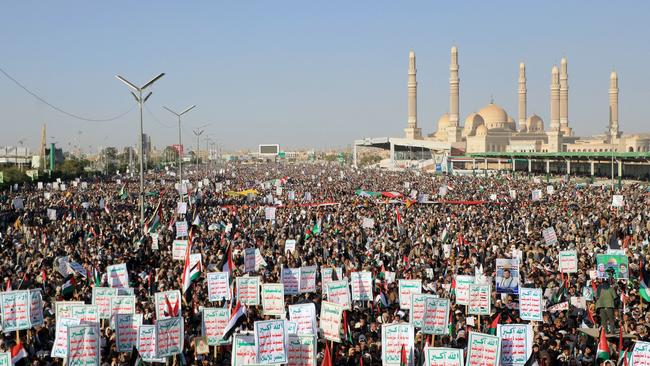 Yemeni demonstrators hold placards during a protest following US and British forces strikes. Picture: AFP