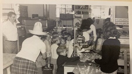 Children take a tour of Stathy Peter Efstathis’ peanut factory in Mackay. Picture: Contributed