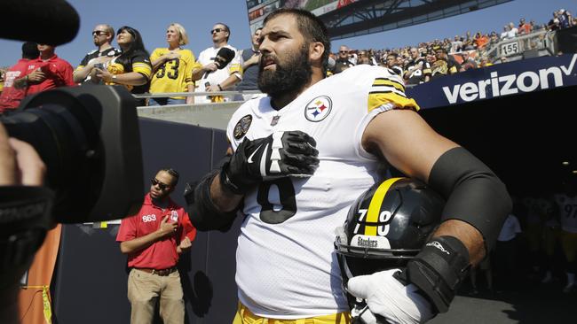 Pittsburgh Steelers offensive tackle and former Army Ranger Alejandro Villanueva stands outside the tunnel alone during the national anthem before the game against the Chicago Bears. Picture: AP