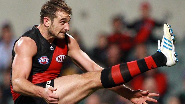 Jobe Watson kicks a goal in 2012. His stellar season was rewarded with a Brownlow Medal, plus selection in the All-Australian and AFL Team of the Year sides. Picture: Paul Kane (Getty Images)